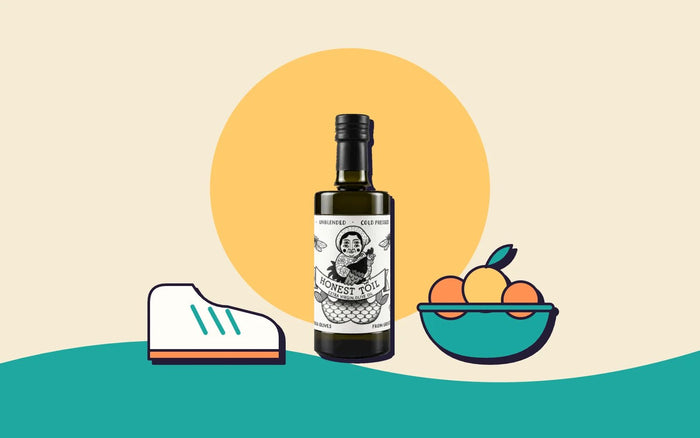A trainer, a bottle of Honest Toil olive oil and a bowl of fruit
