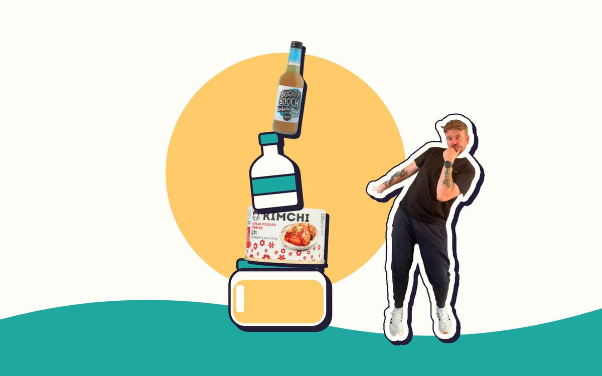 A wobbly tower of kombucha, kimchi, kefir and kraut, with Kombucha Kev steadying it