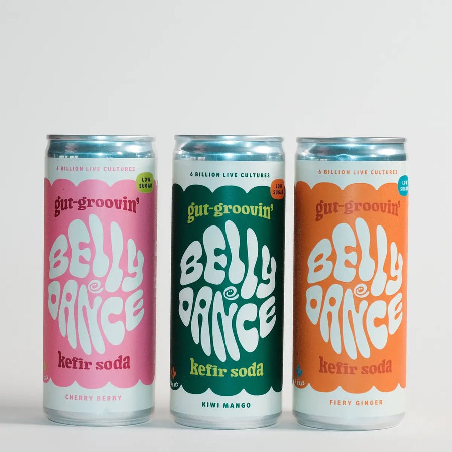 Three cans of Belly Dance water kefir soda: Cherry Berry, Kiwi Mango and Fiery Ginger.