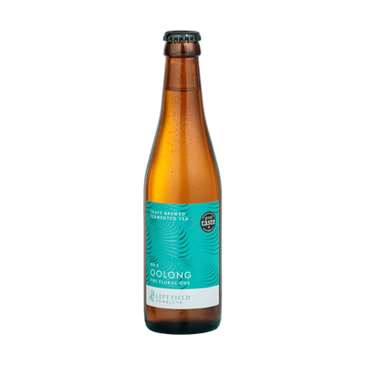 Left Field No.3 Oolong raw kombucha in a tall amber 330ml glass bottle with a black cap and a turquoise swirl-patterned label.