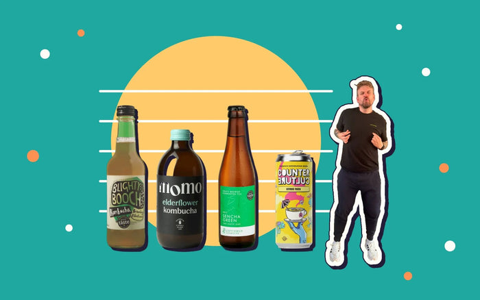A police-style line-up of four kombucha bottles, with Kombucha Kev pointing at his pick
