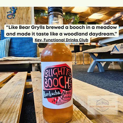 Bottle of Blighty Booch Nettle & Rosehip Kombucha on a wooden table at Functional Drinks Club in Otley