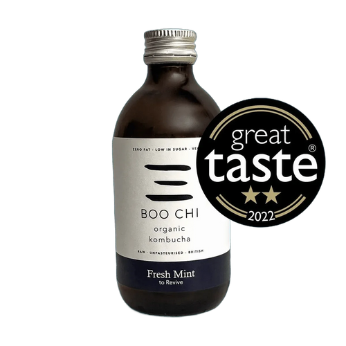 Boo Chi Fresh Mint raw kombucha in an amber 330ml glass bottle with a silver cap and a white label with a navy flavour band, shown with its Great Taste 2022 award badge.