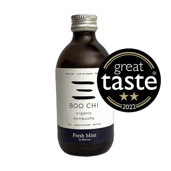 Boo Chi Fresh Mint raw kombucha in an amber 330ml glass bottle with a silver cap and a white label with a navy flavour band, shown with its Great Taste 2022 award badge.