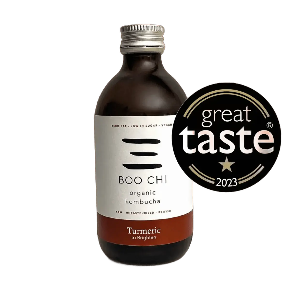 Boo Chi Turmeric & Black Pepper raw kombucha in an amber 330ml glass bottle with a silver cap and a white label with a rust red flavour band, shown with its Great Taste 2023 award badge.