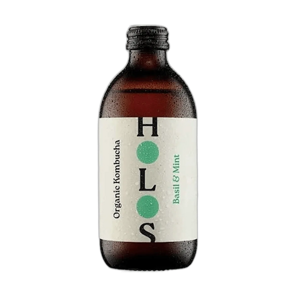 HOLOS Basil & Mint raw kombucha in an amber 330ml glass bottle with a black cap and a cream label with green dots.
