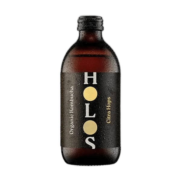 HOLOS Citra Hops raw kombucha in an amber 330ml glass bottle with a black cap and a black label with gold dots.