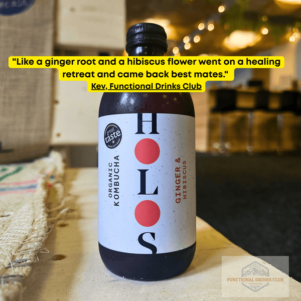 HOLOS Ginger & Hibiscus raw kombucha on a table in the Otley taproom, with Kev's tasting note.
