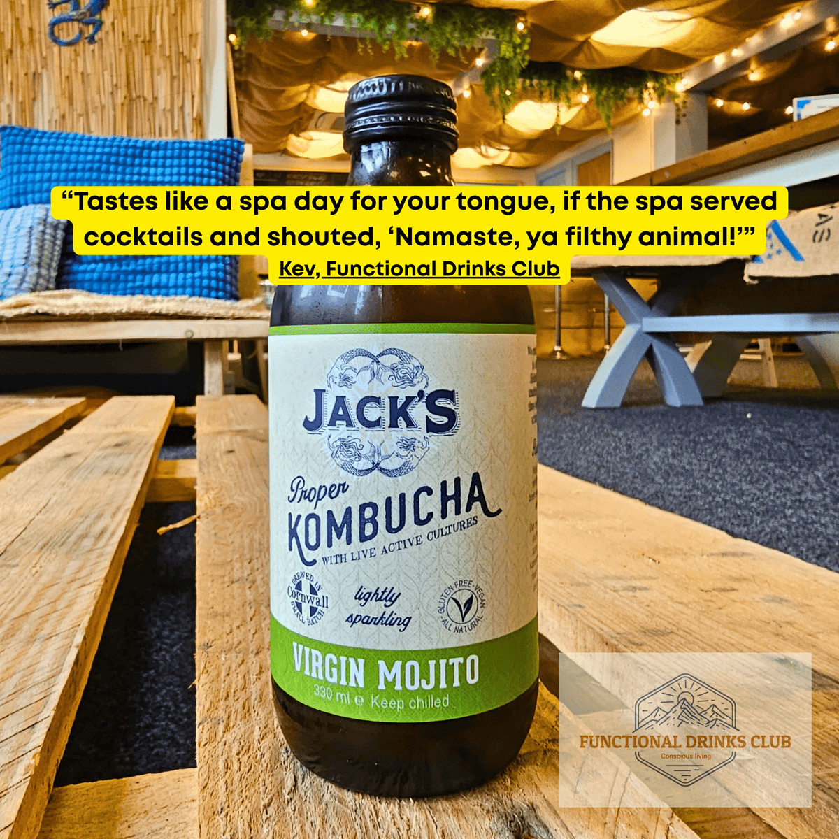 Jack's Virgin Mojito raw kombucha on a wooden pallet table in the Otley taproom, with Kev's tasting note: "Tastes like a spa day for your tongue, if the spa served cocktails and shouted, 'Namaste, ya filthy animal!'"