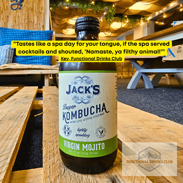 Jack's Virgin Mojito raw kombucha on a wooden pallet table in the Otley taproom, with Kev's tasting note: "Tastes like a spa day for your tongue, if the spa served cocktails and shouted, 'Namaste, ya filthy animal!'"
