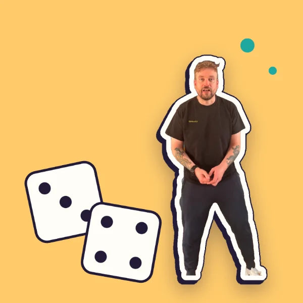 Kev shrugging beside two big dice: the guessing game