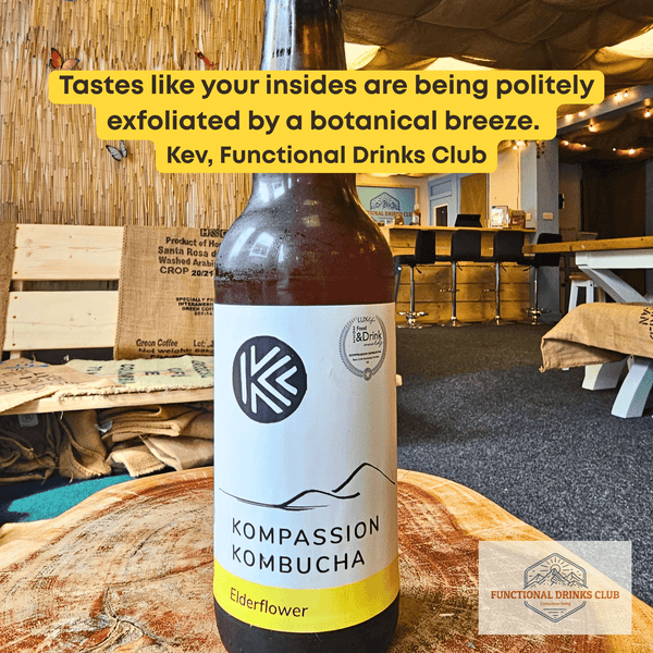 Kompassion Elderflower raw kombucha on a tree-trunk table in the Otley taproom, with Kev's tasting note.