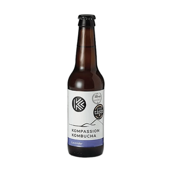 Kompassion Lavender raw kombucha in a tall amber 330ml glass bottle with a black cap and a white label with a violet flavour band and award badges.