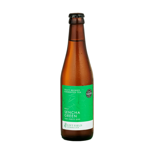 Left Field No.2 Sencha Green raw kombucha in a tall amber 330ml glass bottle with a black cap and a bright green label with a fine line pattern.
