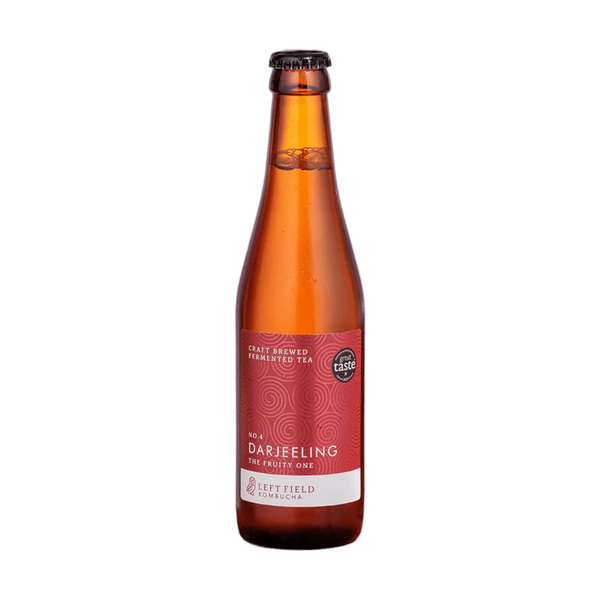 Left Field No.4 Darjeeling raw kombucha in a tall amber 330ml glass bottle with a black cap and a deep red swirl-patterned label.