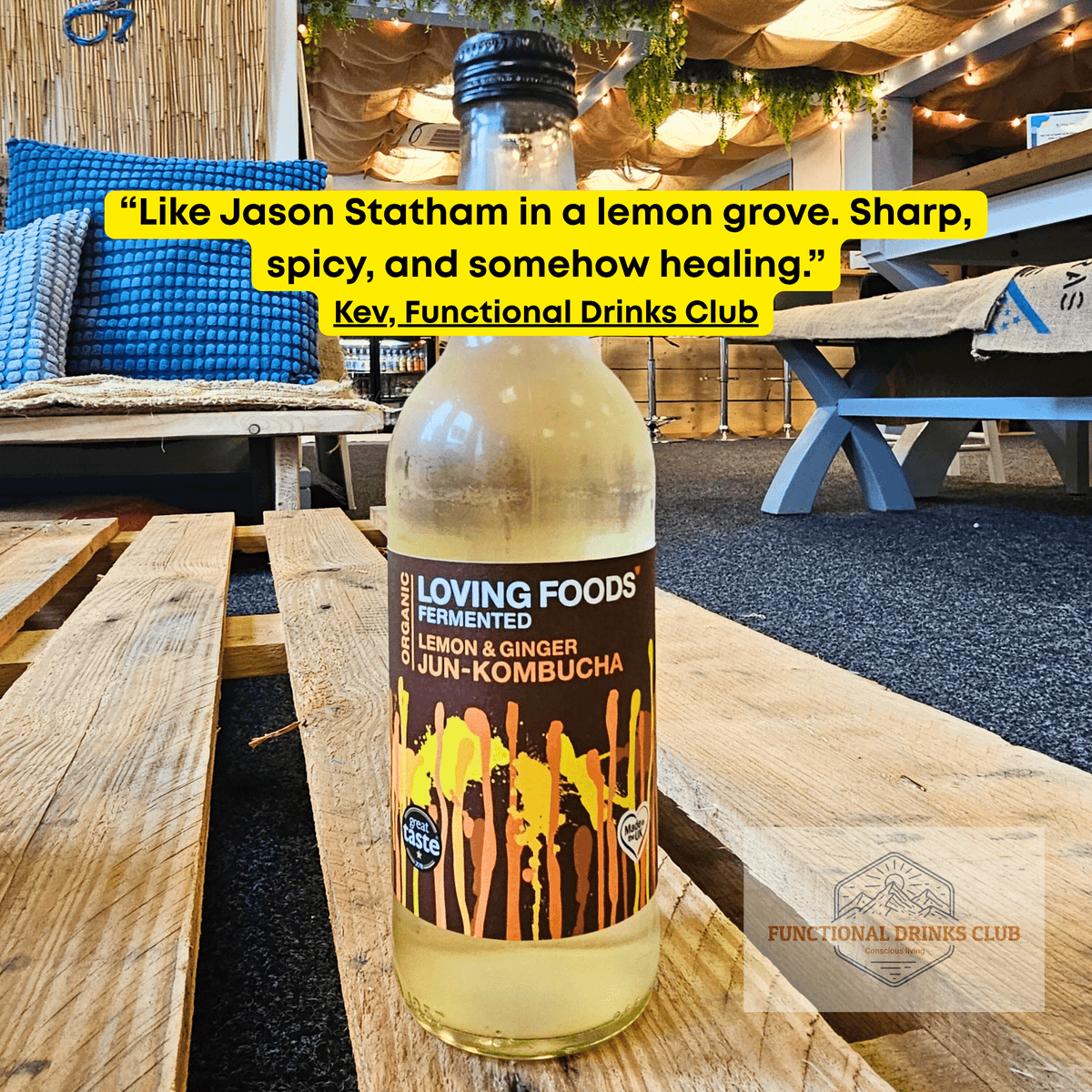 Loving Foods Lemon & Ginger raw jun kombucha on a wooden pallet table in the Otley taproom, with Kev's tasting note.