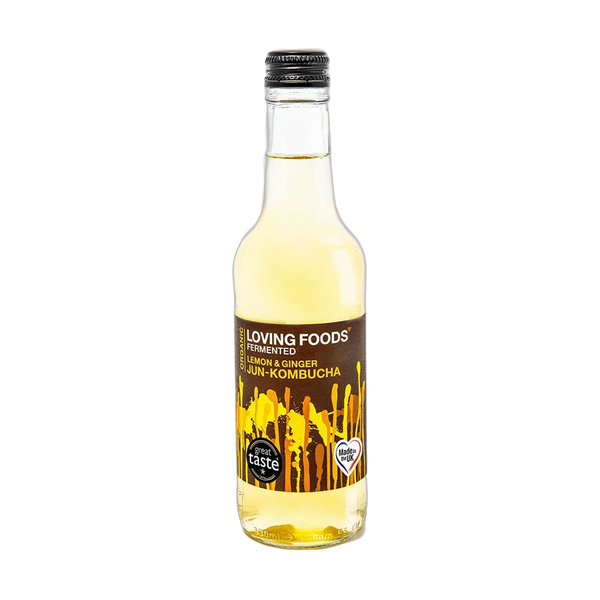 Loving Foods Lemon & Ginger raw jun kombucha in a clear 330ml glass bottle with a black cap and a dark brown label with yellow paint-drip artwork.