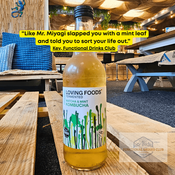 Loving Foods Matcha & Mint raw kombucha on a wooden pallet table in the Otley taproom, with Kev's tasting note: "Like Mr. Miyagi slapped you with a mint leaf and told you to sort your life out."
