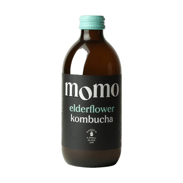 MOMO Elderflower raw kombucha in an amber glass bottle with a mint green cap and a black label with mint green lettering.