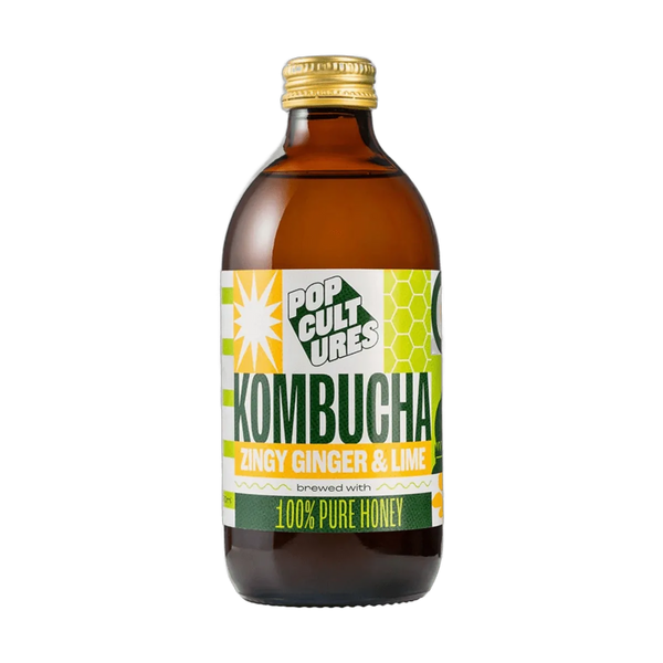 Pop Cultures Zingy Ginger & Lime raw jun kombucha in an amber 330ml glass bottle with a gold cap and a colourful lime green and yellow patchwork label.