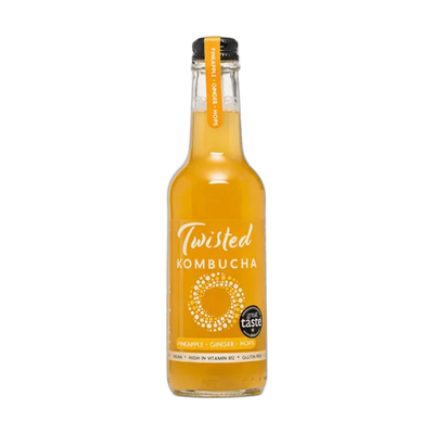 Twisted Pineapple, Ginger & Hops raw kombucha in a clear 330ml glass bottle with a black cap and a golden yellow label with an orange neck tag.