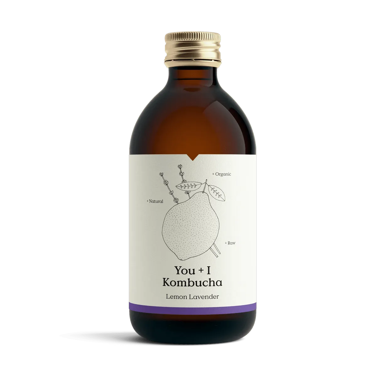 You + I Lemon & Lavender raw kombucha in an amber glass bottle with a gold cap and a cream label with a botanical line drawing and a purple band.