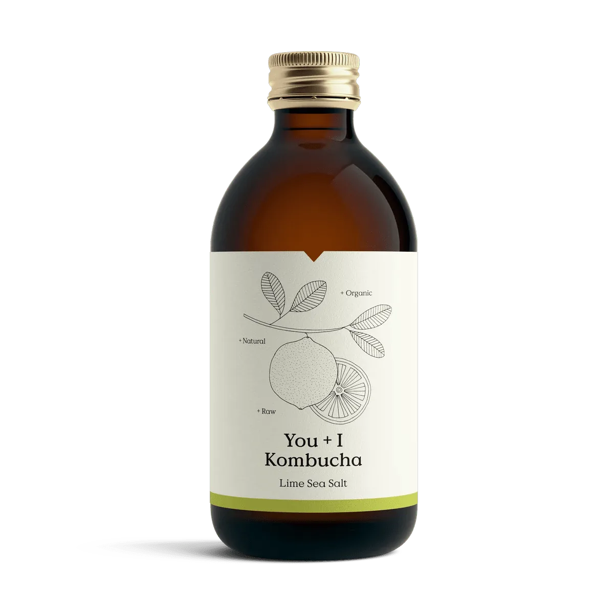 You + I Lime & Sea Salt raw kombucha in an amber glass bottle with a gold cap and a cream label with a botanical line drawing and a lime green band.