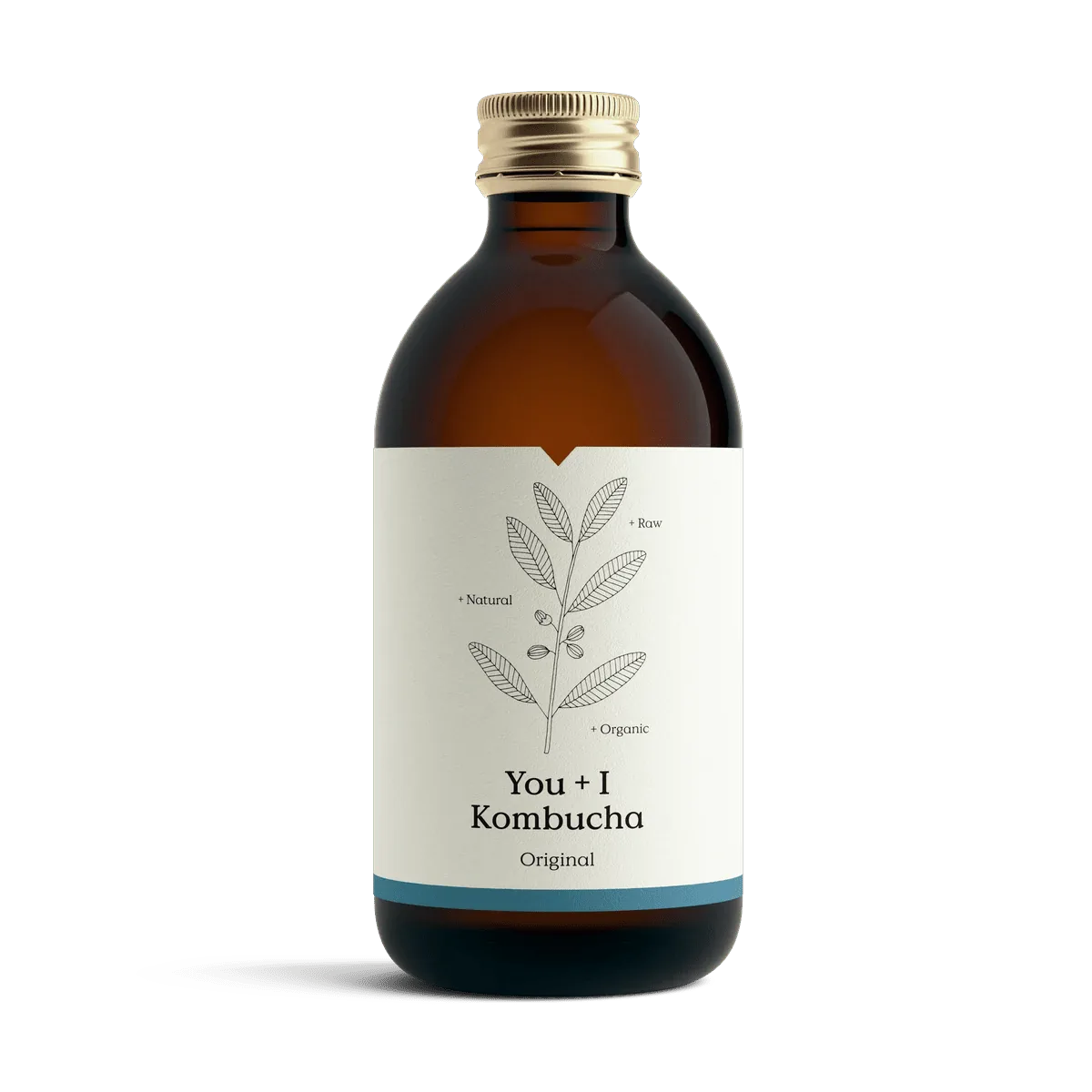 You + I Original raw kombucha in an amber glass bottle with a gold cap and a cream label with a botanical line drawing and a blue band.